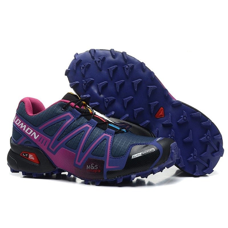 "Robuuste Solamon wandelsneakers met antislipzool en stevige constructie, in wit en zwart, ideaal voor avonturen."