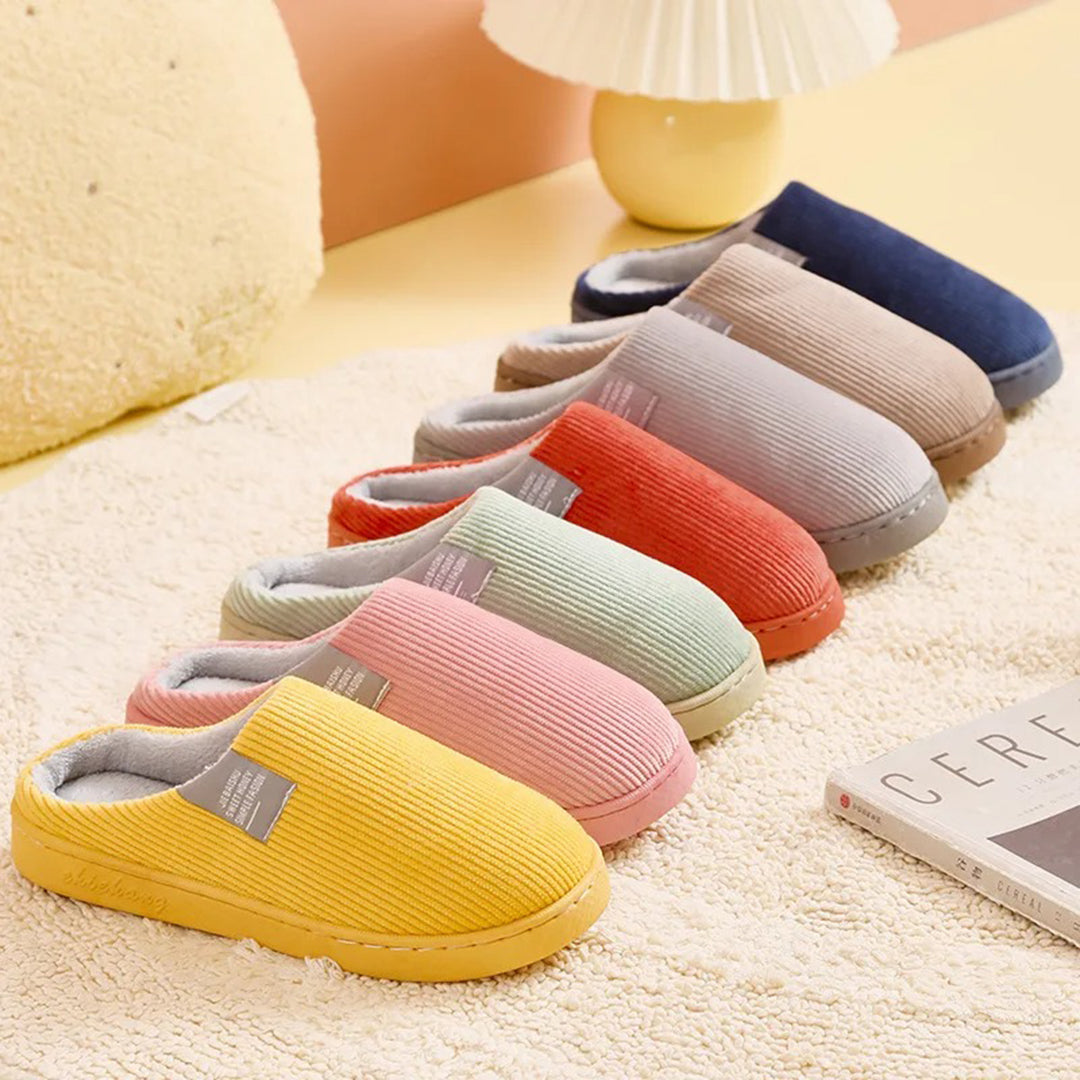 "Roze Rosela slip-on pantoffels voor dames met zacht binnenmateriaal en stevige zool, ideaal voor winterse gezelligheid."