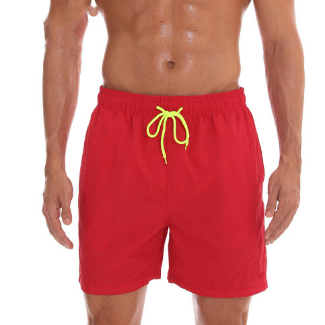 "Sneldrogende heren zwembroek met sportief design, elastische tailleband en praktische zakken voor strandactiviteiten."