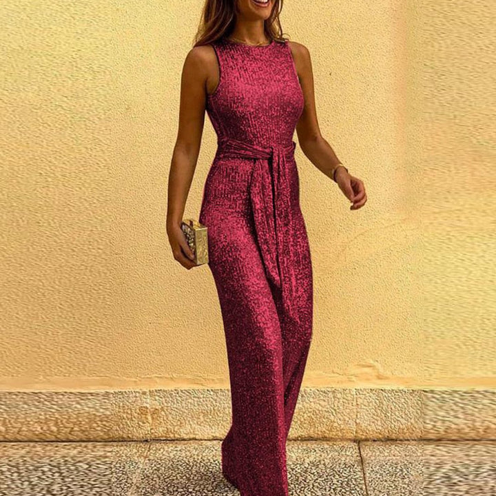 "Sprankelende dames jumpsuit met glinsterende stof en aanpasbare taille, ideaal voor feestelijke gelegenheden en elegantie."