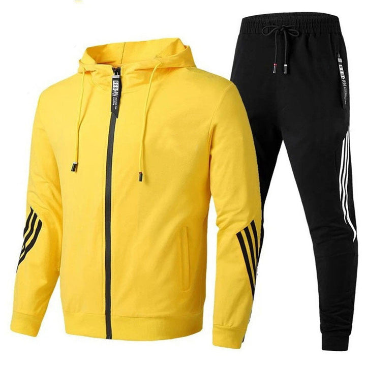 "Stijlvol Adonis heren sporttrainingspak, comfortabel lichtgrijs ontwerp ideaal voor sportieve en casual gelegenheden."