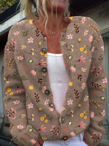 Stijlvol damesvest met kleurrijke bloemenprint, gebreid voor optimale warmte en comfort tijdens koude dagen.