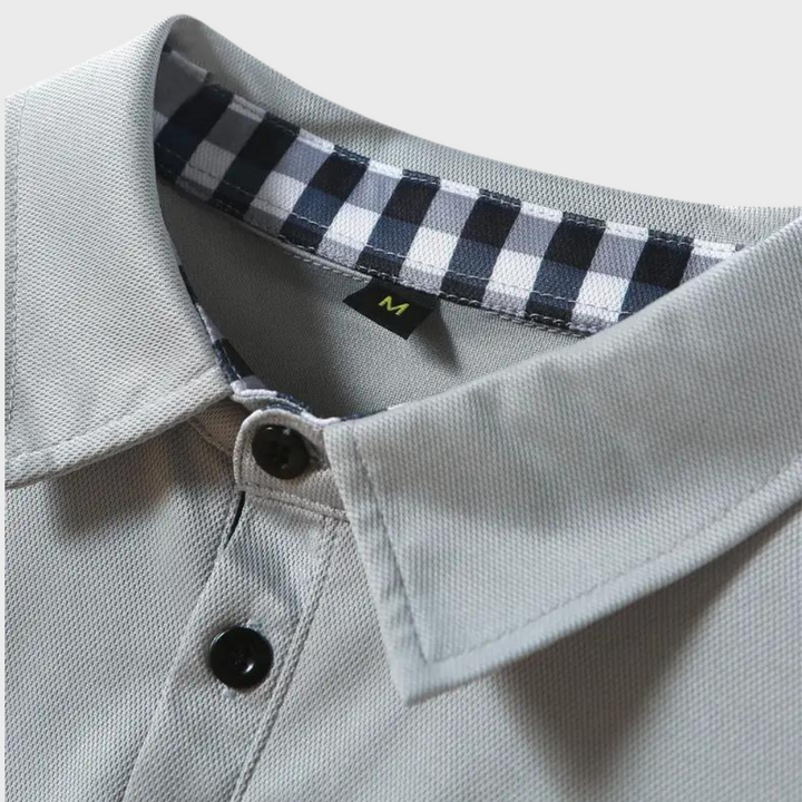 Stijlvol heren poloshirt met lange mouwen in marineblauw, zilvergrijs en zwart voor comfort en veelzijdige uitstraling.