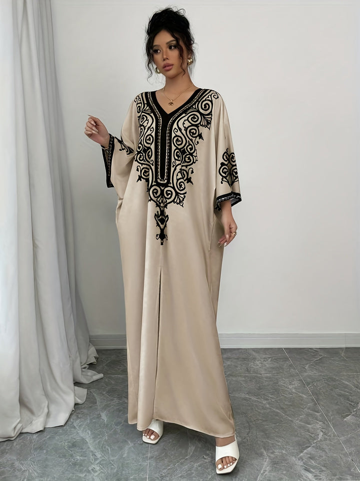 "Stijlvolle abaya jurk met V-hals, lange mouwen en kleurrijke etnische print, voor een elegante en culturele look."