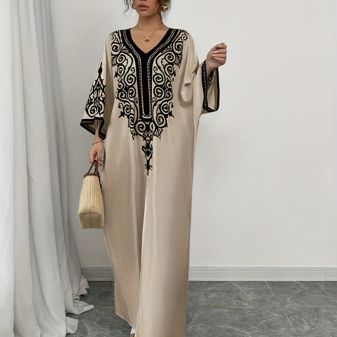 "Stijlvolle abaya jurk met V-hals, lange mouwen en kleurrijke etnische print, voor een elegante en culturele look."