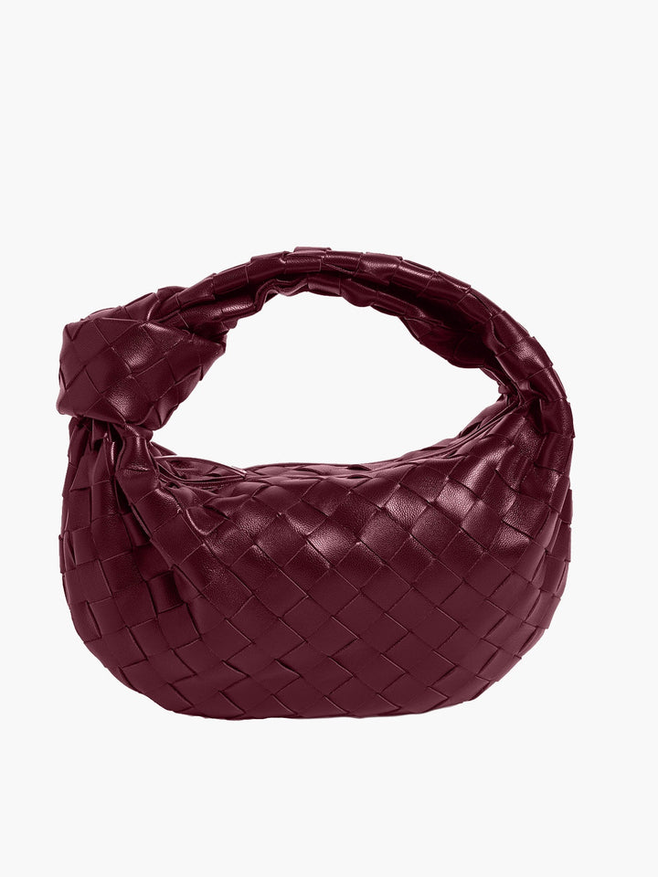 "Stijlvolle geweven mini tas met rijke texturen, handgemaakt vakmanschap, ideaal als veelzijdig accessoire voor vrouwen."
