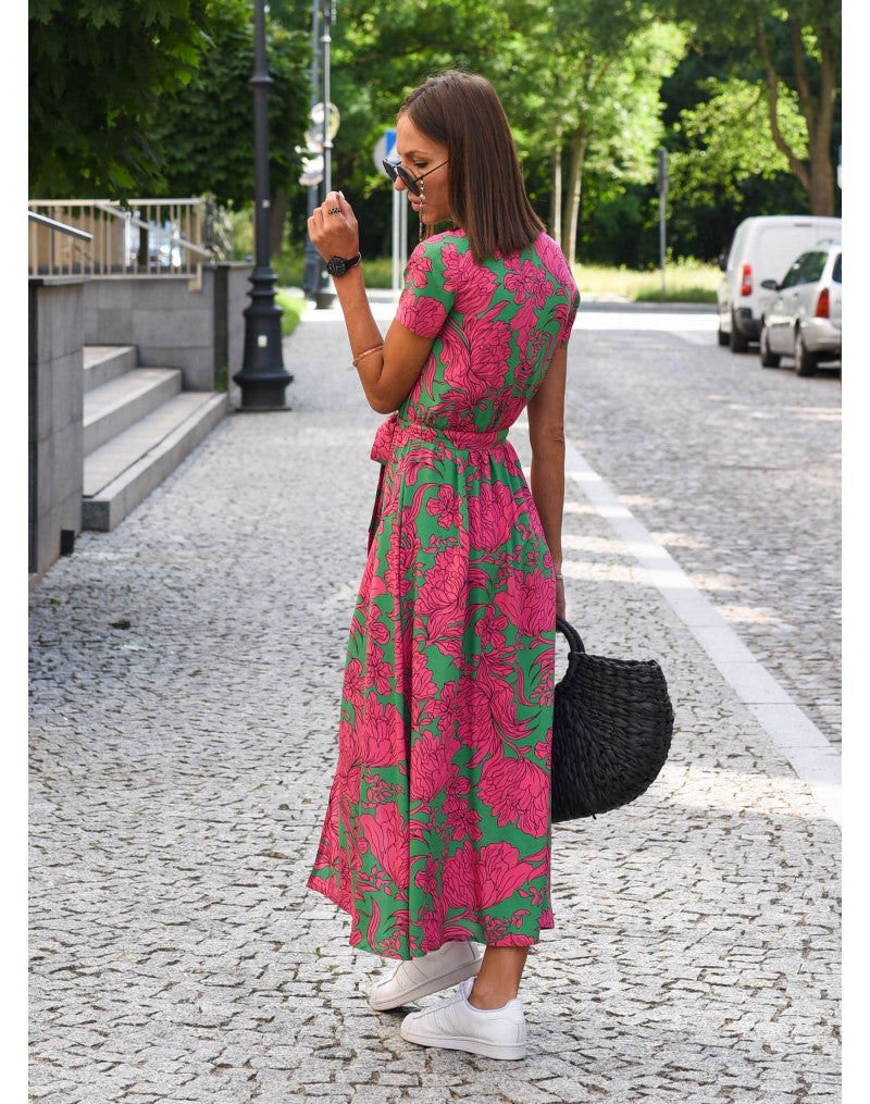 "Stijlvolle Jade Maxi Jurk met frisse bloemenprint, diepe V-hals en hoge split, ideaal voor zomerse dagen."