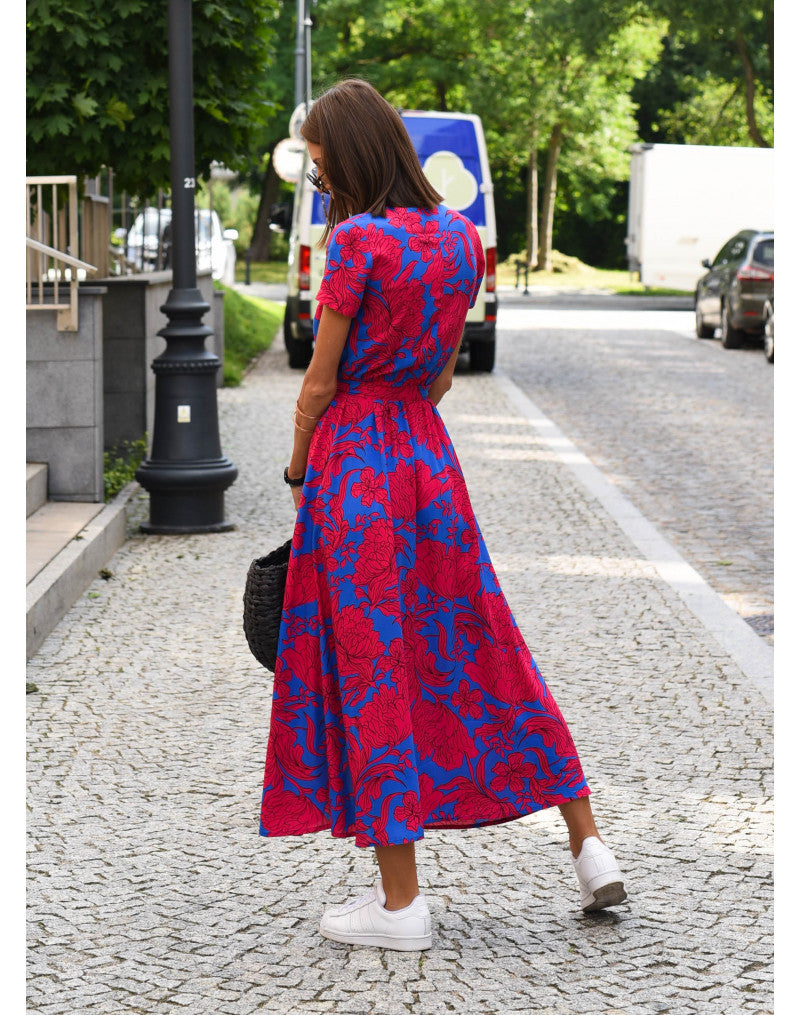"Stijlvolle Jade Maxi Jurk met frisse bloemenprint, diepe V-hals en hoge split, ideaal voor zomerse dagen."