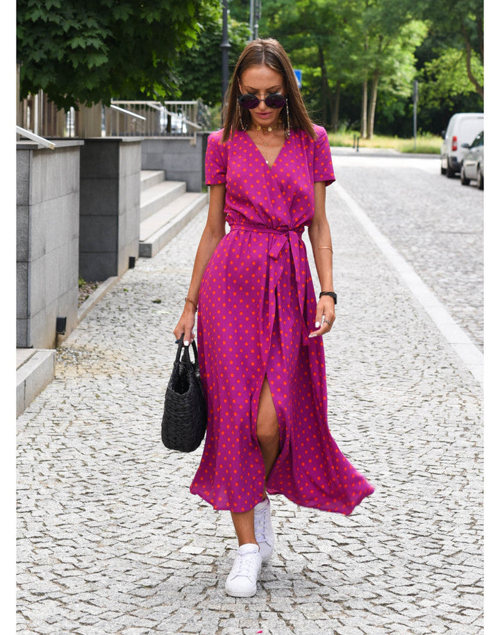 "Stijlvolle Jade Maxi Jurk met frisse bloemenprint, diepe V-hals en hoge split, ideaal voor zomerse dagen."