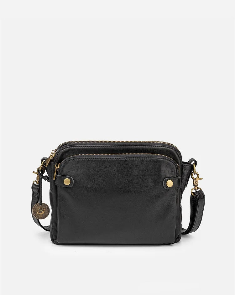 "Stijlvolle leren crossbody schoudertas met verstelbare riem in elegante kleur en ruime opbergruimte voor dames."