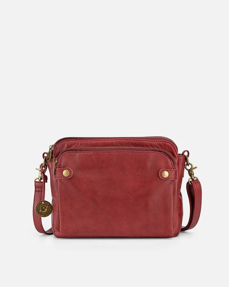 "Stijlvolle leren crossbody schoudertas met verstelbare riem in elegante kleur en ruime opbergruimte voor dames."