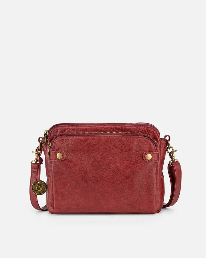 "Stijlvolle leren crossbody schoudertas met verstelbare riem in elegante kleur en ruime opbergruimte voor dames."