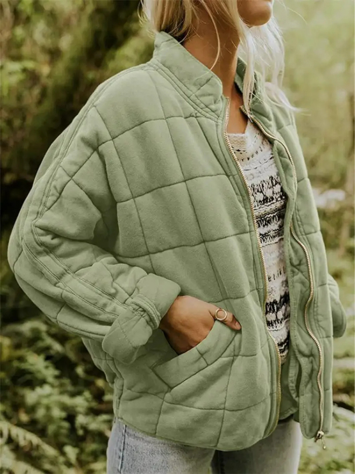 "Stijlvolle, oversized damesovergangsjas in meerdere kleuren zoals donkergrijs en groen, ideaal voor wisselend weer."