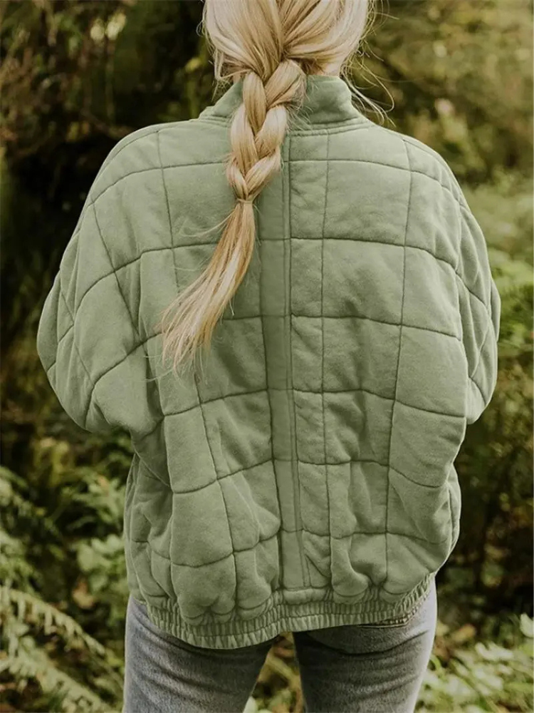 "Stijlvolle, oversized damesovergangsjas in meerdere kleuren zoals donkergrijs en groen, ideaal voor wisselend weer."