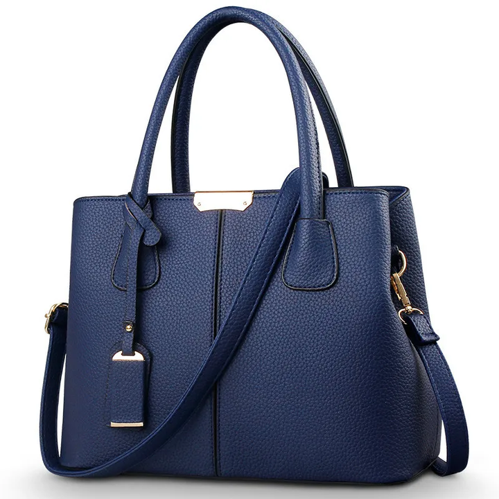 "Stijlvolle Romina Crossbody Draagtas in paars met strak, vierkant ontwerp en comfortabele band voor een elegante look."