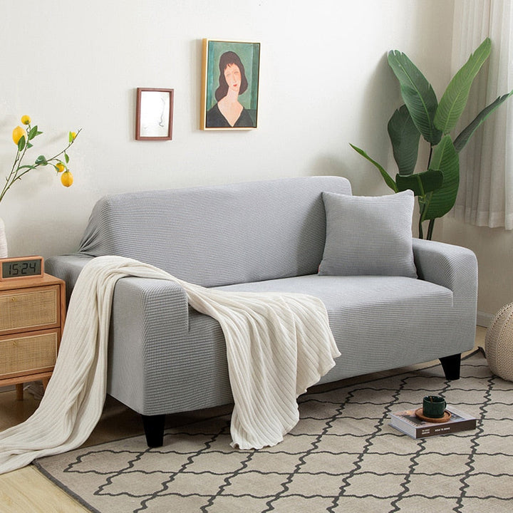 "StretchGuard rekbare bankhoes, elastisch, stijlvolle bescherming, antislip, perfecte pasvorm, modern interieurdesign"