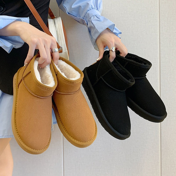 Stylische winter enkellaarzen voor dames met warme bontvoering, stevige zool, en elegant uiterlijk, ideaal voor koude dagen.