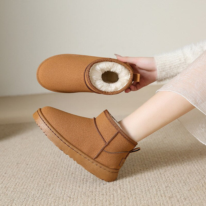 Stylische winter enkellaarzen voor dames met warme bontvoering, stevige zool, en elegant uiterlijk, ideaal voor koude dagen.