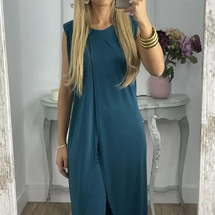 "Sylvia tweedelige damesoutfit, elegante katoenen top en uitlopende broek, comfortabel en geschikt voor elke gelegenheid."