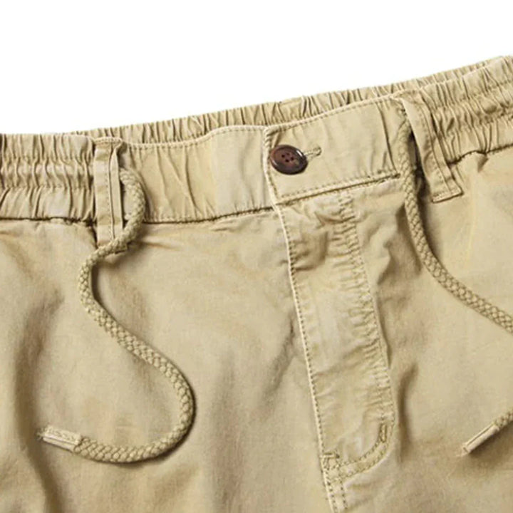 "Tactical cargo broek heren, duurzaam katoen, multifunctionele zakken, stoere streetwear stijl, comfortabele pasvorm."