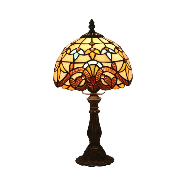 "Tiffany-stijl tafellamp, blauw en geel glas, klassieke loodlijnen, warme en uitnodigende sfeer, ambachtelijk design."