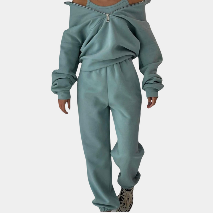 "Trendy dames trainingspak in groen met joggingbroek en vest met halve rits, stijlvol en comfortabel."