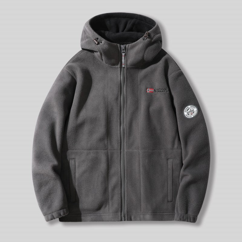 "Unisex ultra warme fleece jas in zacht materiaal voor heren en dames, perfect voor koude winterdagen met praktische zakken."