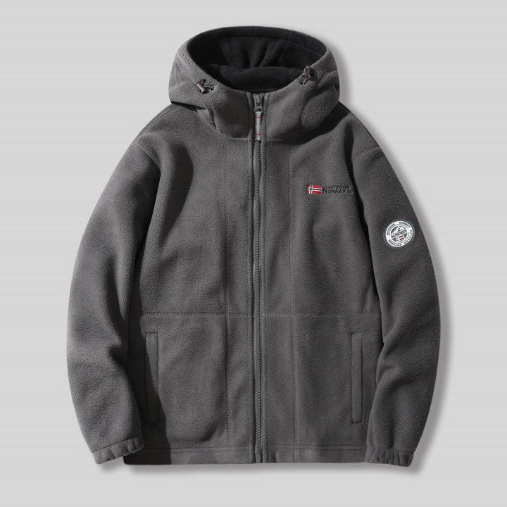 "Unisex ultra warme fleece jas in zacht materiaal voor heren en dames, perfect voor koude winterdagen met praktische zakken."