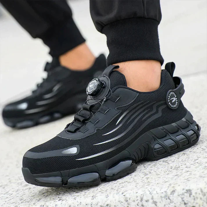 "Veiligheidssneakers met S3-classificatie, ademend donkergrijs mesh, zwarte rubberzool, ideaal voor dames op de werkvloer."