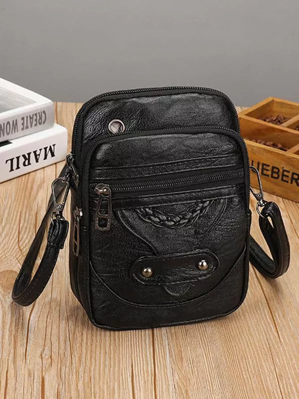 "Vintage leren schoudertas met envelopsluiting, elegant ontwerp, van duurzaam Zwitsers leer met verstelbare riem."