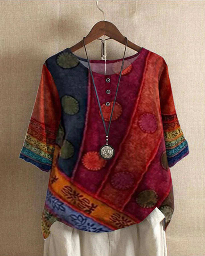 "Vintage multicolor blouse dames in losse pasvorm, felle kleuren en uniek patroon, perfect voor een bohemian look."
