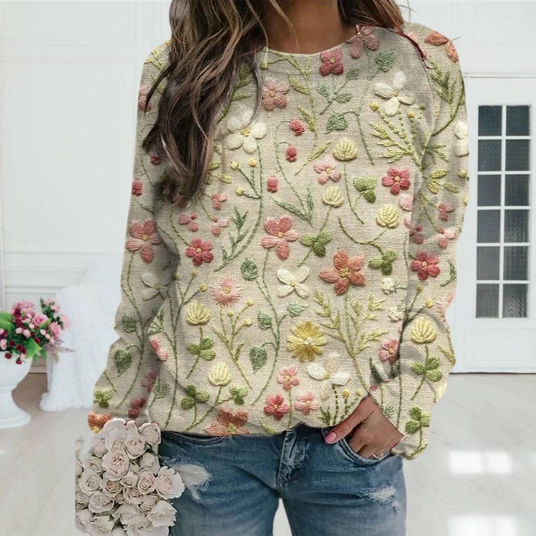 "Vrouwentrui met gestikte bloemen, katoenen stof, ronde hals, lange mouwen, comfort en stijl, lente garderobe must-have."