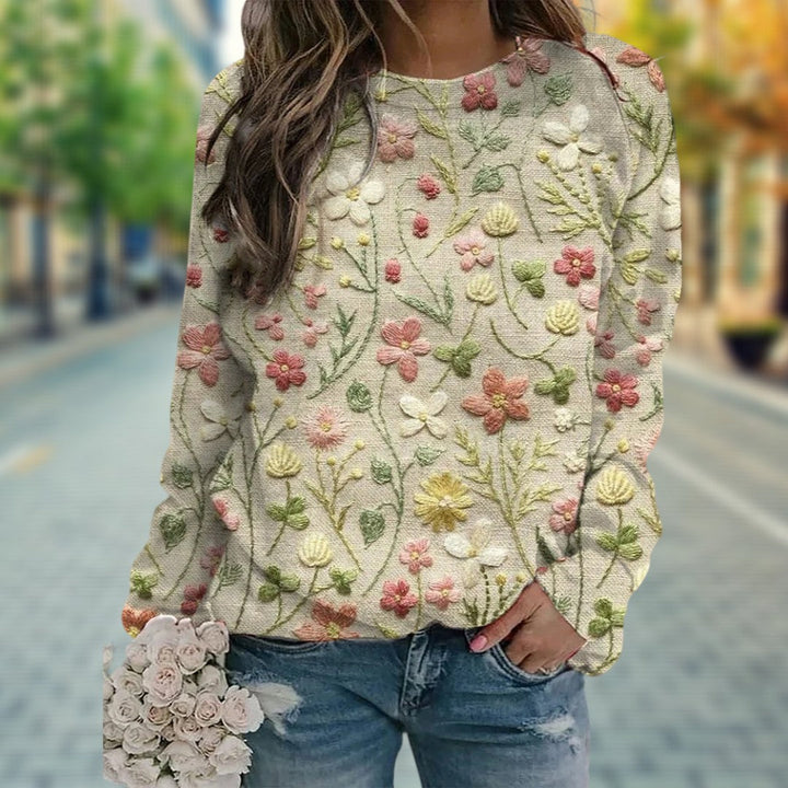 "Vrouwentrui met gestikte bloemen, katoenen stof, ronde hals, lange mouwen, comfort en stijl, lente garderobe must-have."