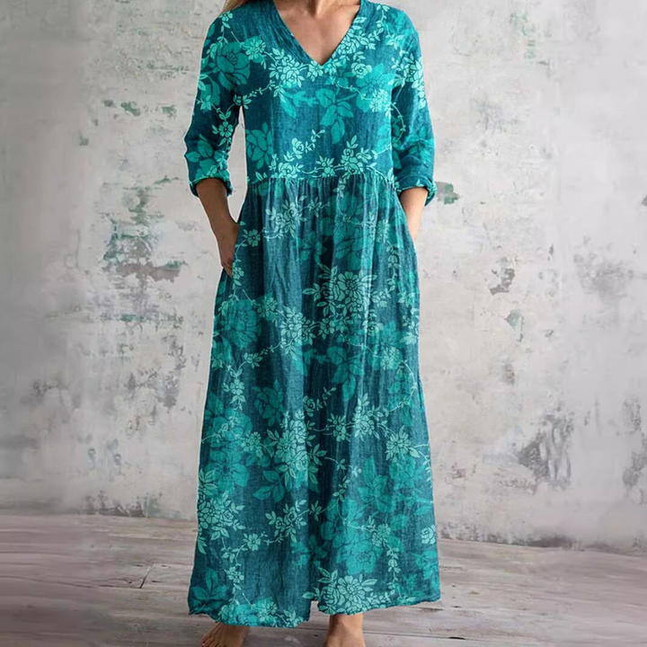 Zomerjurk met elegante V-hals en romantisch bloemenpatroon, perfect voor dames, comfortabel en luchtig voor warme dagen.