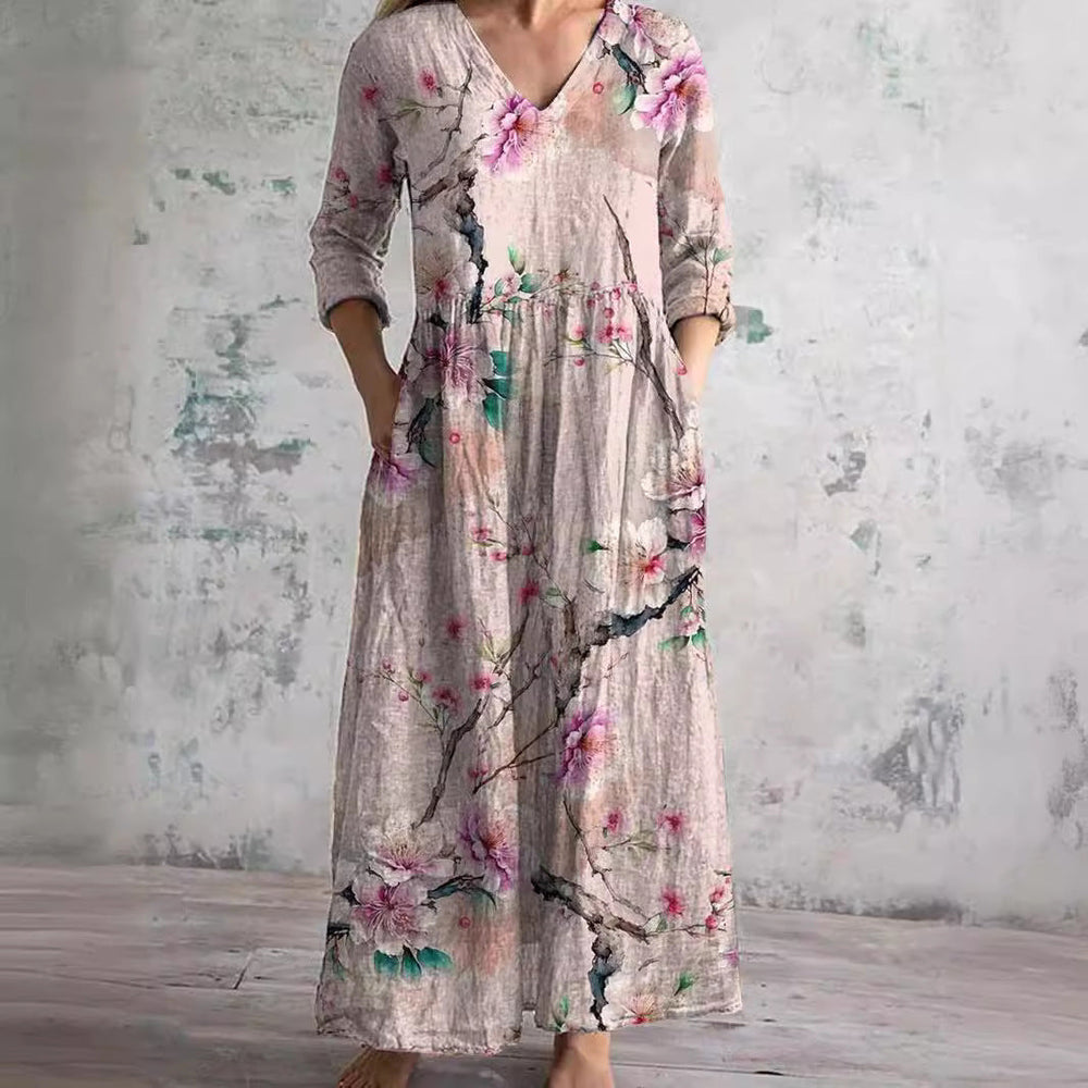 Zomerjurk met elegante V-hals en romantisch bloemenpatroon, perfect voor dames, comfortabel en luchtig voor warme dagen.