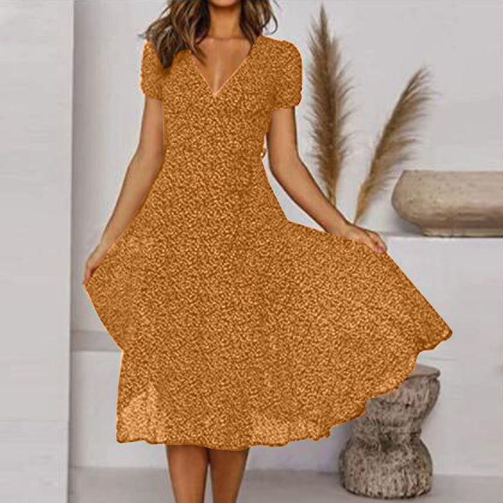 Zomerse A-lijn jurk met bloemenprint, V-hals, elegante en comfortabele pasvorm, ideaal voor zomerse dagen.