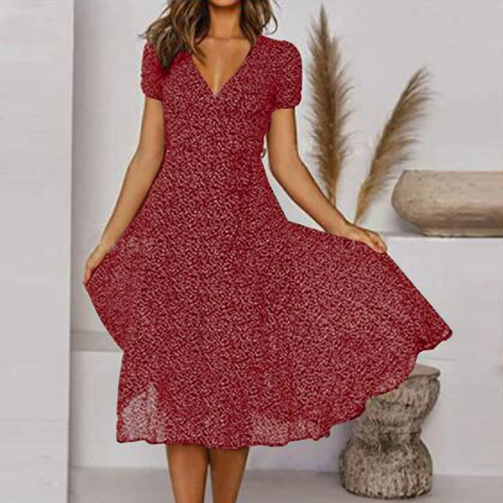 Zomerse A-lijn jurk met bloemenprint, V-hals, elegante en comfortabele pasvorm, ideaal voor zomerse dagen.