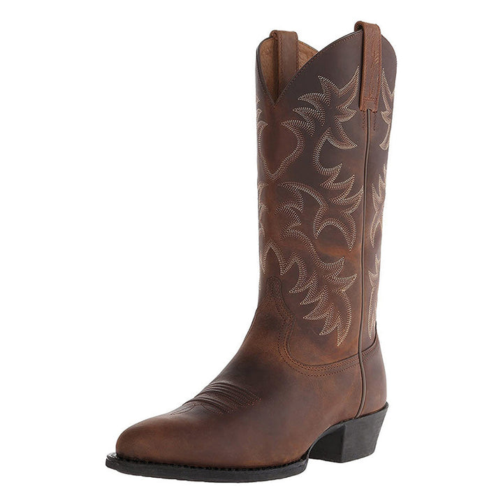 "Zwarte en bruine heren cowboylaarzen van rundleer met spitse neuzen en stijlvolle stiksels voor een klassieke western look."