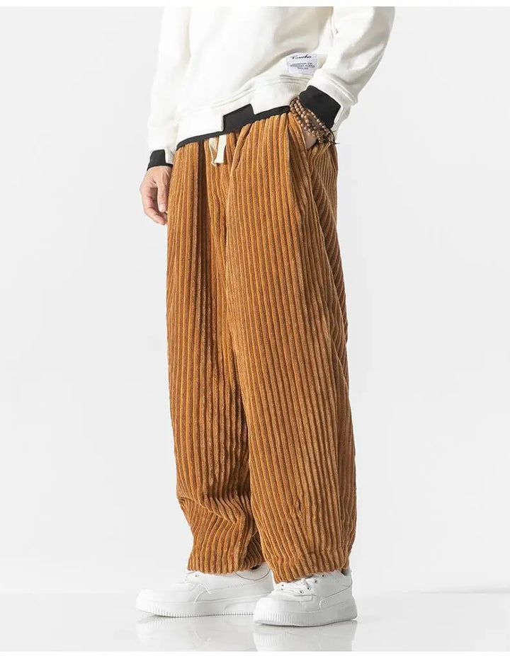 "Zwarte geribbelde relaxed fit broek, corduroy ontwerp, elastische taille, urban stijl, perfect voor casual dagen."