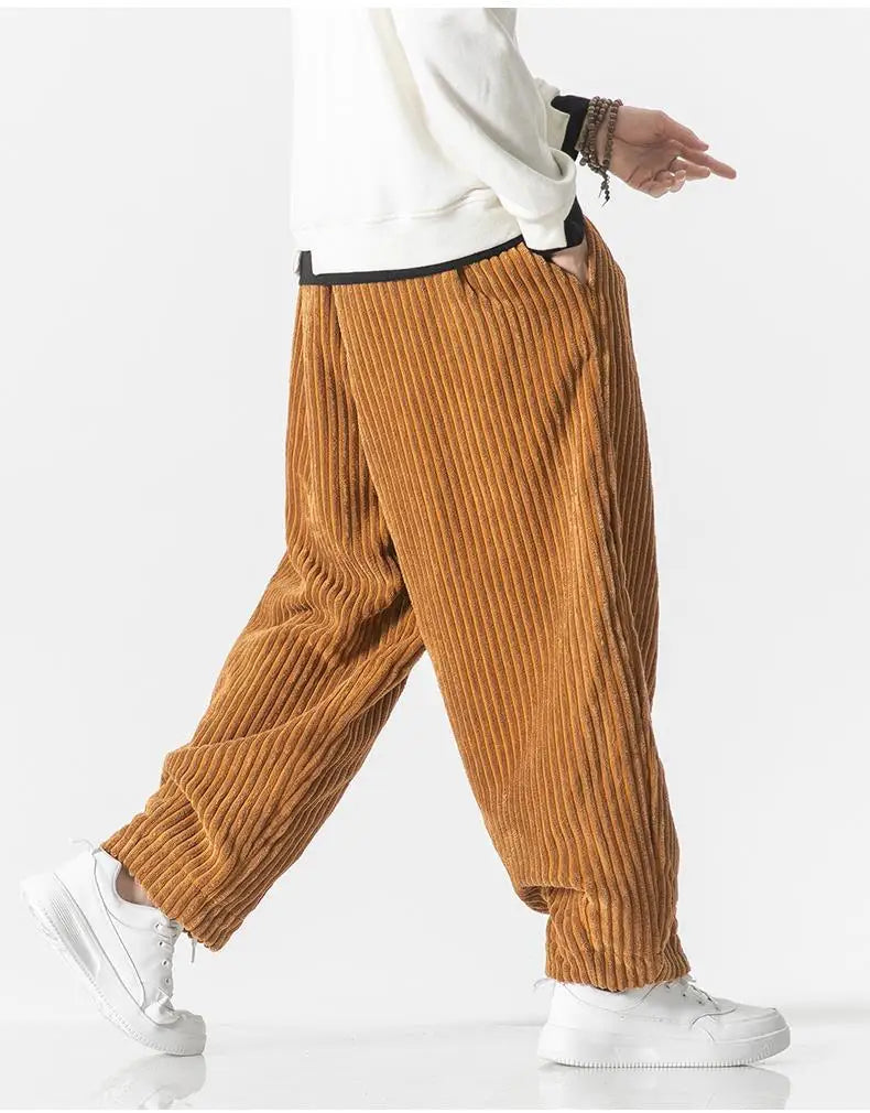 "Zwarte geribbelde relaxed fit broek, corduroy ontwerp, elastische taille, urban stijl, perfect voor casual dagen."
