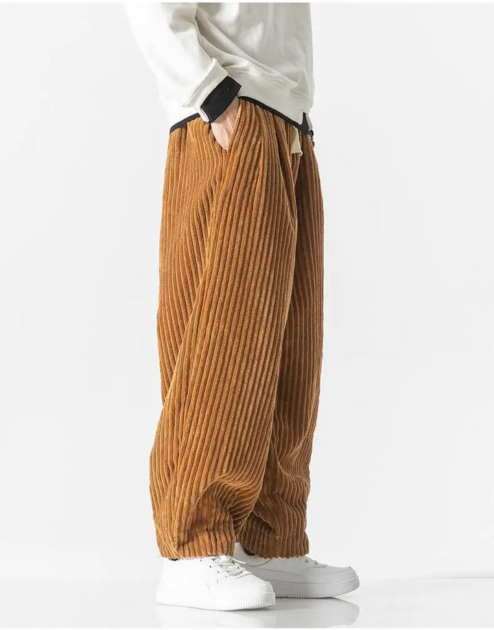 "Zwarte geribbelde relaxed fit broek, corduroy ontwerp, elastische taille, urban stijl, perfect voor casual dagen."