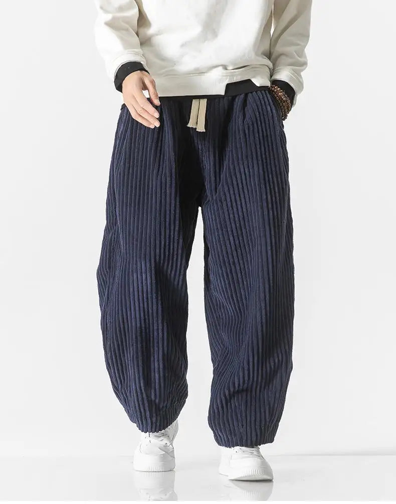 "Zwarte geribbelde relaxed fit broek, corduroy ontwerp, elastische taille, urban stijl, perfect voor casual dagen."