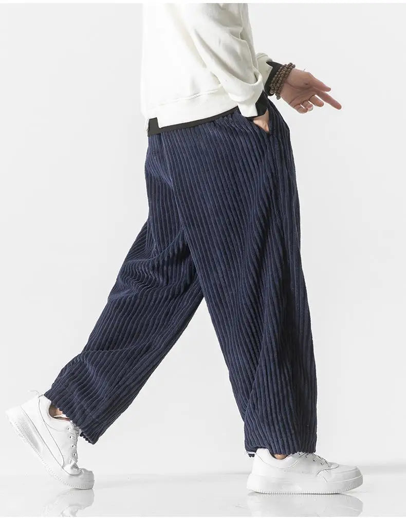"Zwarte geribbelde relaxed fit broek, corduroy ontwerp, elastische taille, urban stijl, perfect voor casual dagen."