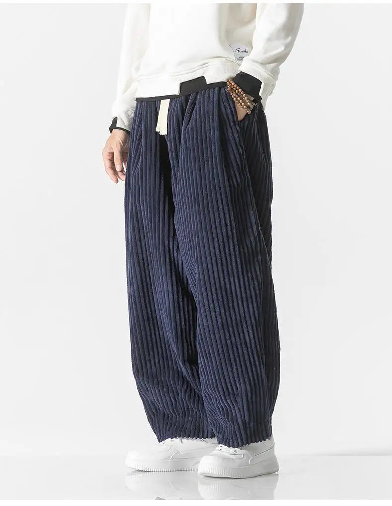 "Zwarte geribbelde relaxed fit broek, corduroy ontwerp, elastische taille, urban stijl, perfect voor casual dagen."