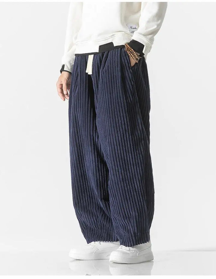 "Zwarte geribbelde relaxed fit broek, corduroy ontwerp, elastische taille, urban stijl, perfect voor casual dagen."