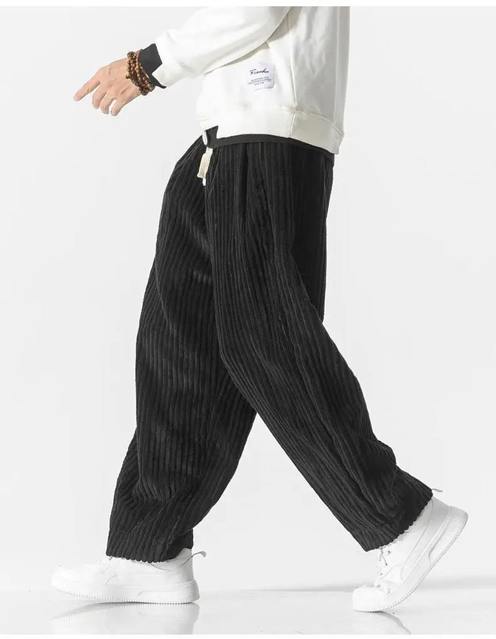 "Zwarte geribbelde relaxed fit broek, corduroy ontwerp, elastische taille, urban stijl, perfect voor casual dagen."