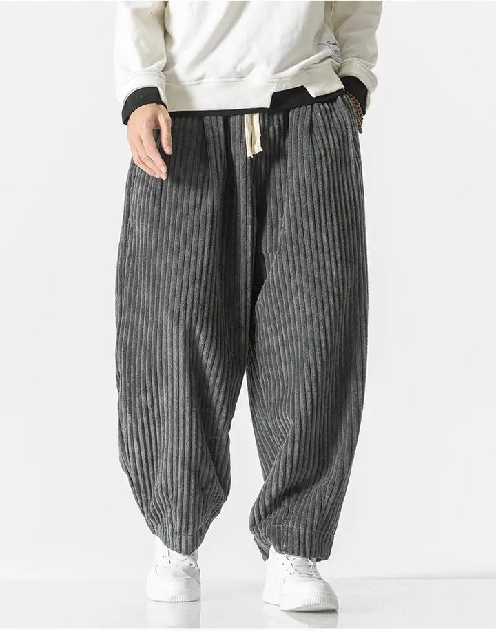 "Zwarte geribbelde relaxed fit broek, corduroy ontwerp, elastische taille, urban stijl, perfect voor casual dagen."