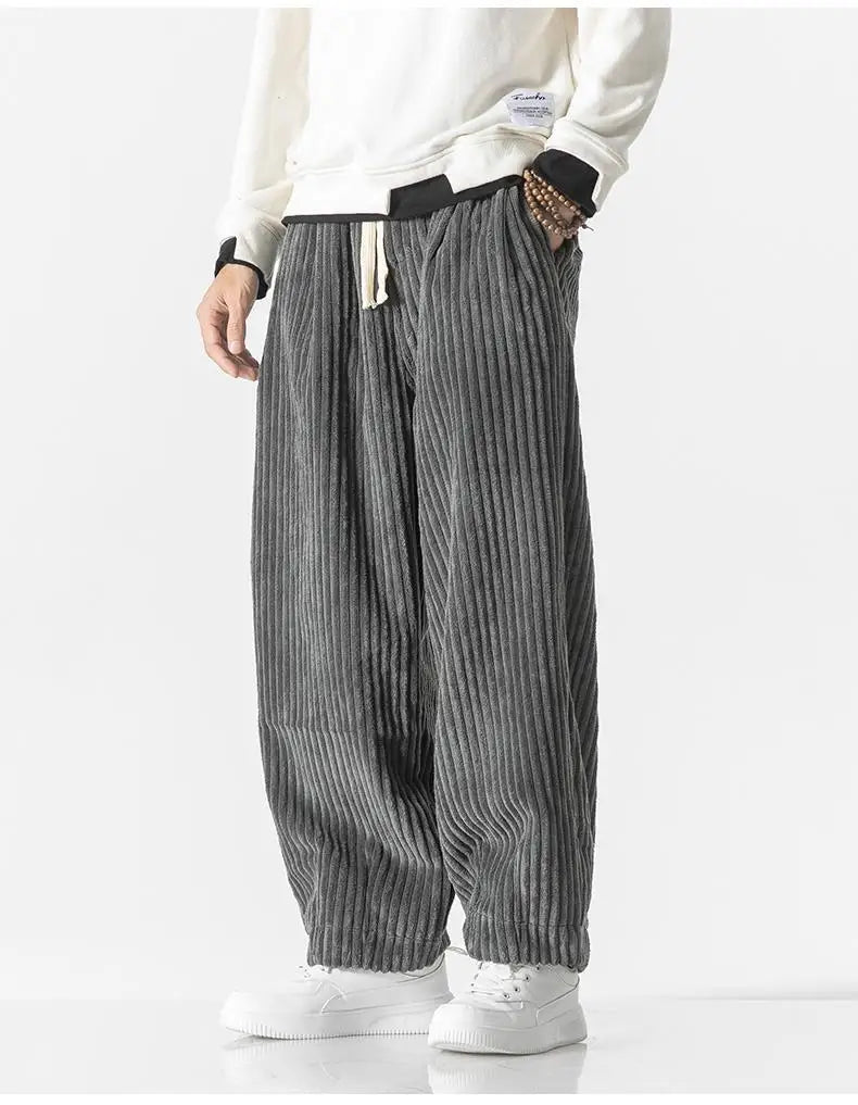 "Zwarte geribbelde relaxed fit broek, corduroy ontwerp, elastische taille, urban stijl, perfect voor casual dagen."