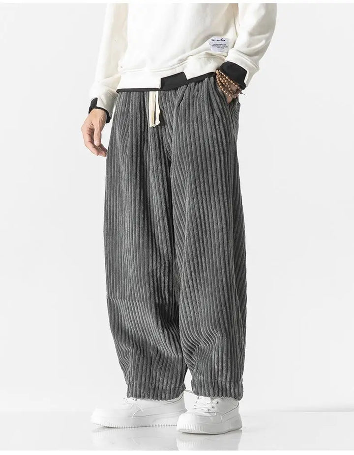 "Zwarte geribbelde relaxed fit broek, corduroy ontwerp, elastische taille, urban stijl, perfect voor casual dagen."