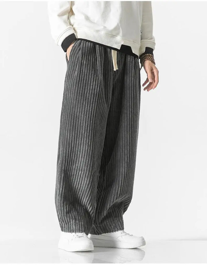 "Zwarte geribbelde relaxed fit broek, corduroy ontwerp, elastische taille, urban stijl, perfect voor casual dagen."